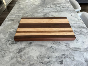 Maple walnut, and a zebra wood cutting board