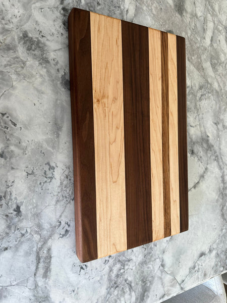 Maple walnut, and a zebra wood cutting board